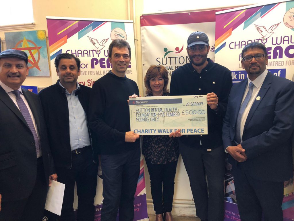 Charity Walk for Peace present Sutton Mental Health Foundation with £500.00 cheque